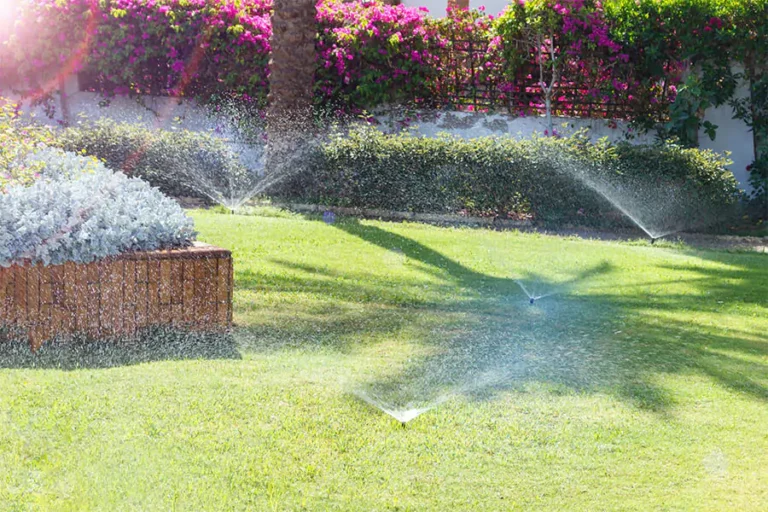Sprinkler system watering in a beautiful lawn