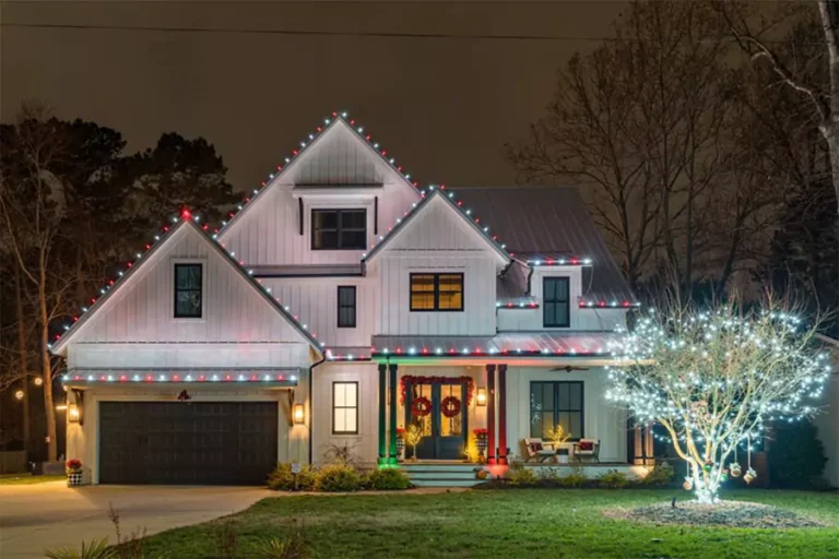 Beautiful home in Cypress, TX with holiday lighting installation featuring roofline lights and illuminated tree decorations