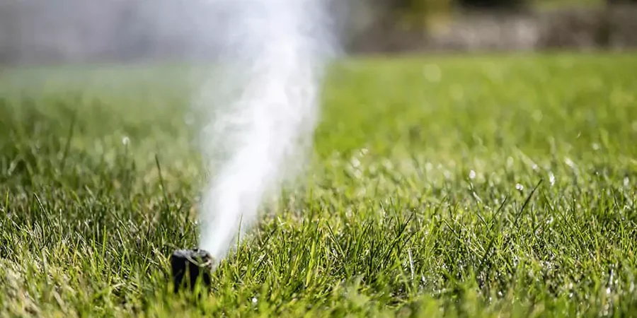 Sprinkler winterization in a green landscape